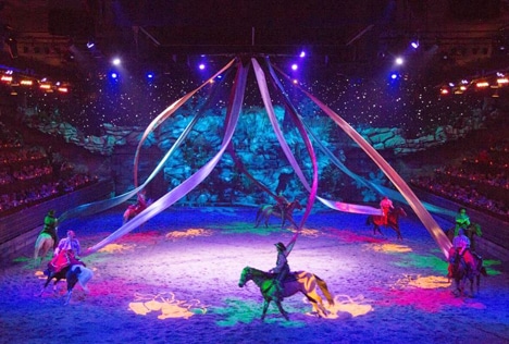 The dinner show features 32 horses in a live performance.