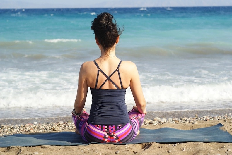 Yoga mat on the beach