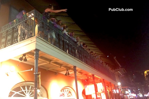Bourbon Street balcony bead toss New Orleans Bourbon Street balcony bead toss New Orleans