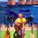 Jimmy Buffett concert solo on stage
