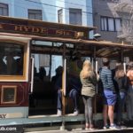 San Francisco Cable Cars people riding the rails