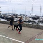 runners with dog San Diego marina