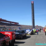 NASCAR cars lined up in the pits