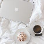 laptop and coffee in bed