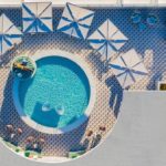 Bar Moxy Miami Beach hotel rooftop pool girl sunbathing