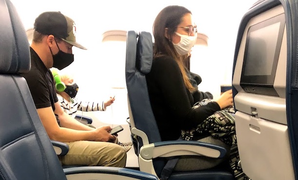 airline passengers wearing masks