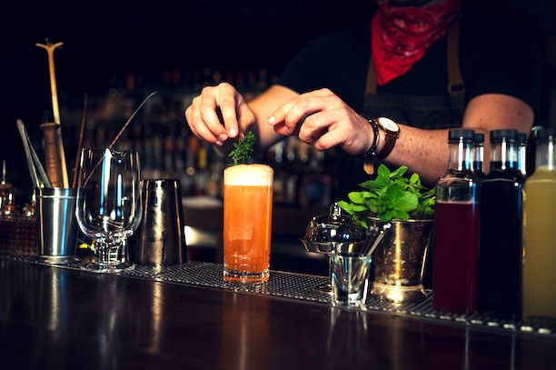 Bartender making Redemption rye-whiskey cocktail