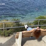 La Jolla Cove woman relaxing on a bench