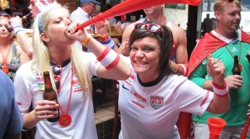 World Cup watch party girls blowing into horn