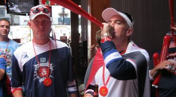 fan blowing into a horn during a World Cup watch party