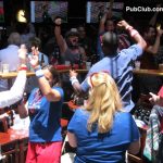 fans celebrate a goal in a World Cup bar