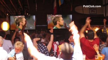 fans partying in a bar while watching World Cup soccer