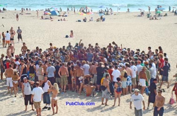 people on the beach watching the margarita wrestling contest people on the beach watching the margarita wrestling contest
