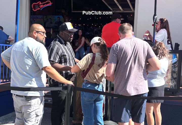 doorman checking IDs at a bar