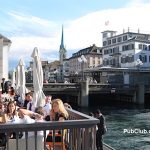 people dining along the river in Zurich Switzerland
