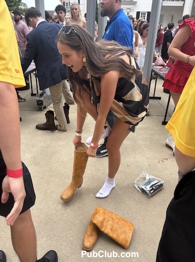 Alabama coed gets her cowboy boots inspected by stadium security